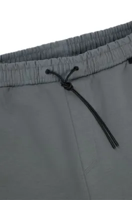 Pantalones de chándal de algodón con detalle decorativo de logotipo reflectante