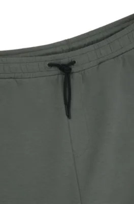 Pantalones de chándal de algodón elástico con logo estampado