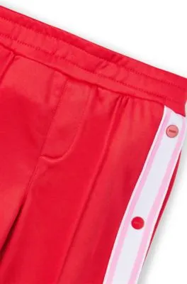 Pantalones de chándal para niños con botones automáticos en las costuras laterales