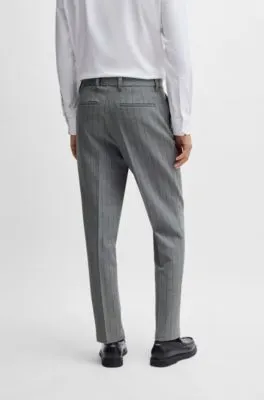 Pantalones slim fit en tejido elástico con raya diplomática