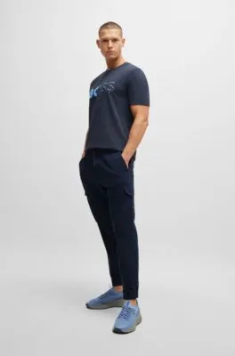 Pantalones tapered fit en popelín elástico de planchado fácil